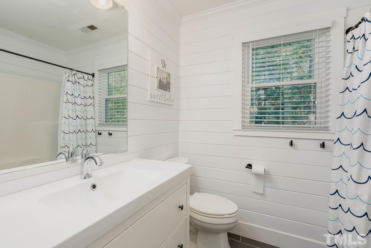 108 Donna Place Cary, NC 27513 - Photo 20 of 30 a bathroom with a sink toilet and shower