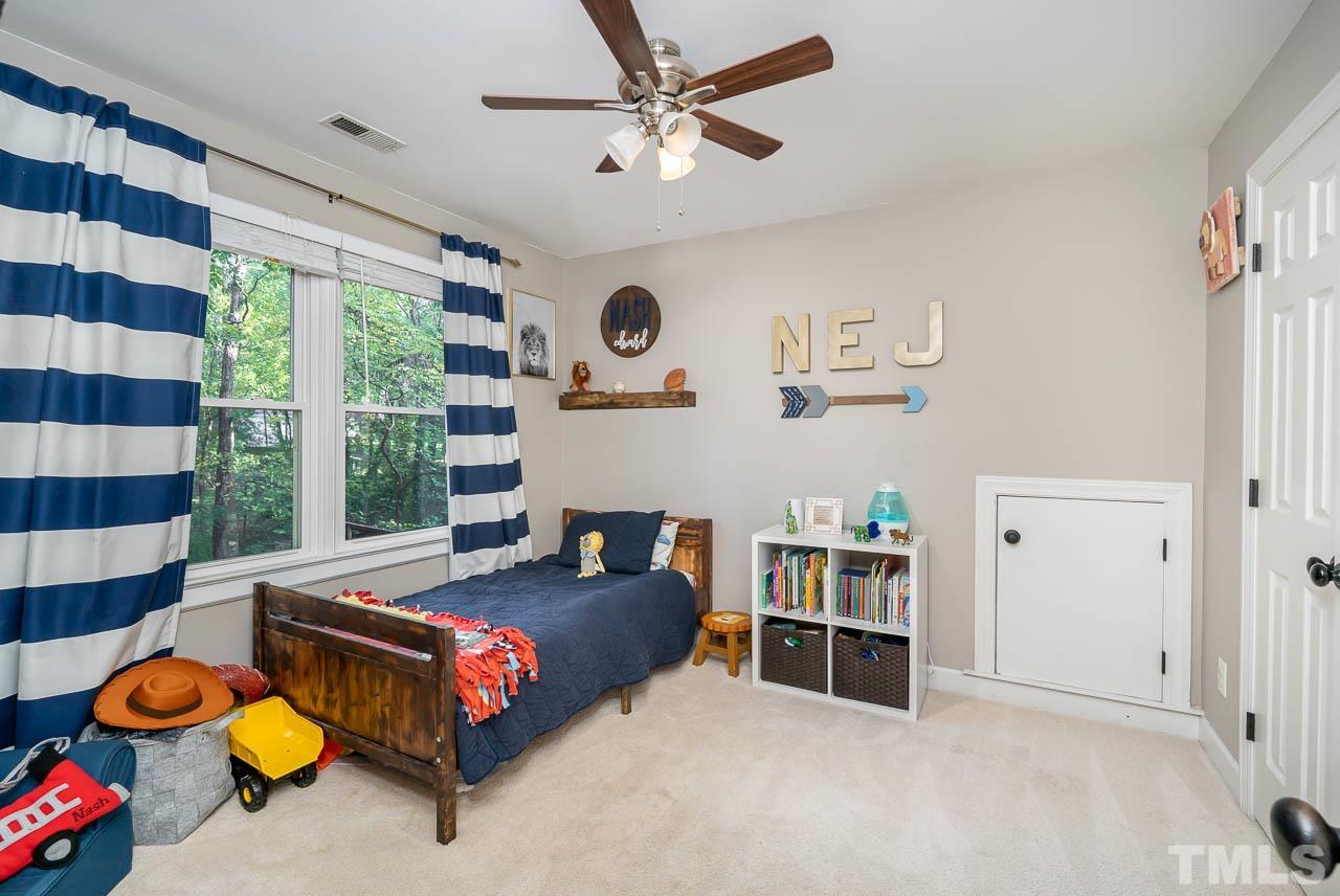 108 Donna Place Cary, NC 27513 - Photo 21 of 30 a living room with furniture and a large window