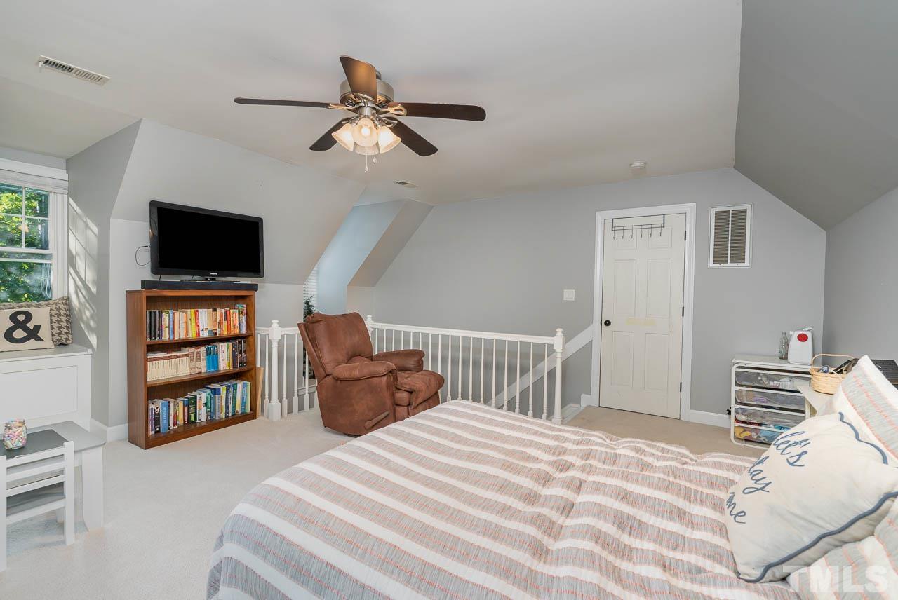 108 Donna Place Cary, NC 27513 - Photo 25 of 30 a bedroom with a bed and a television
