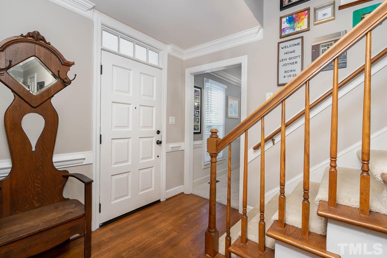 108 Donna Place Cary, NC 27513 - Photo 3 of 30 a view of an entryway with wooden floor and staircase