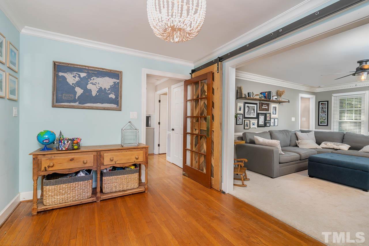 108 Donna Place Cary, NC 27513 - Photo 9 of 30 a living room with furniture and a wooden floor