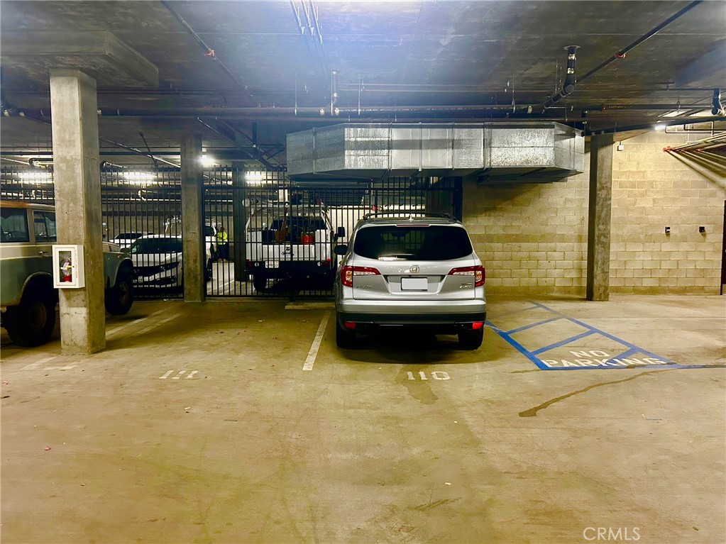 300 East 4th Street, Unit 101 Long Beach, CA 90802 - Photo 29 of 64 a car parked in a parking garage
