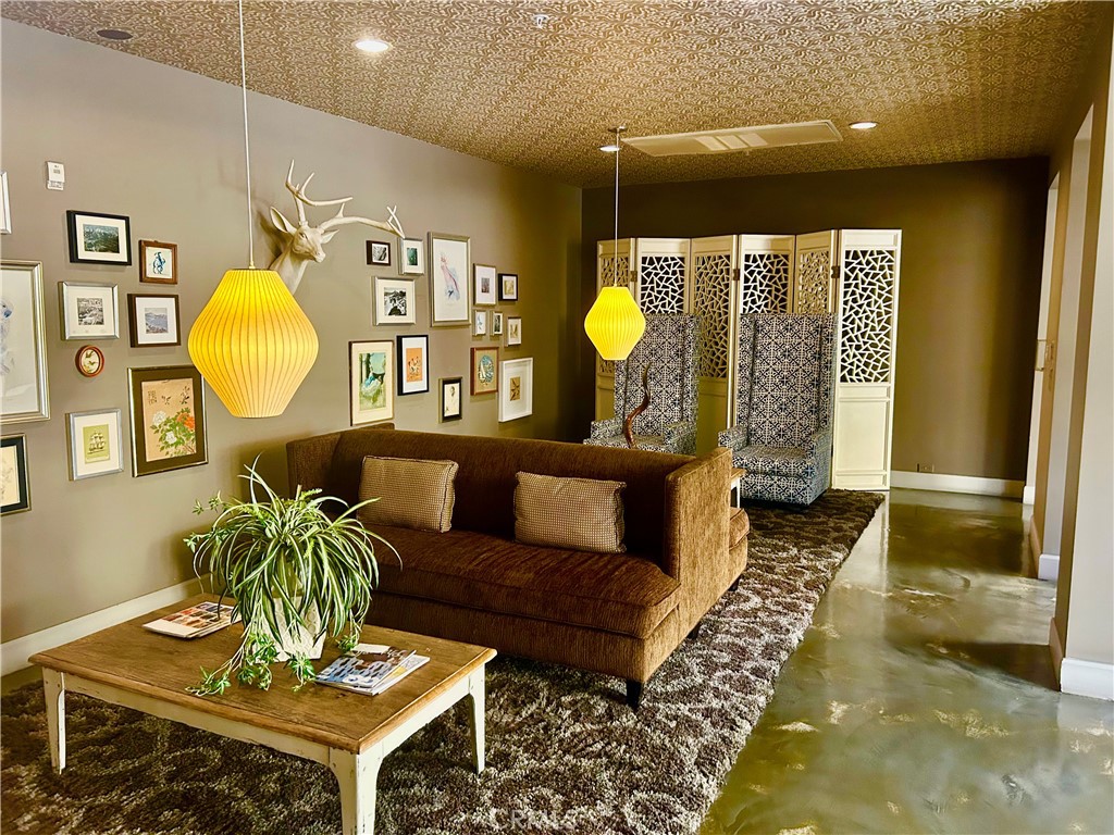 300 East 4th Street, Unit 101 Long Beach, CA 90802 - Photo 32 of 64 a living room with furniture and a rug