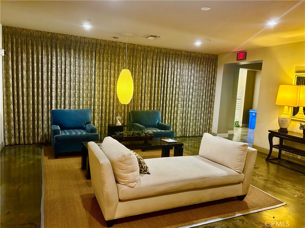 300 East 4th Street, Unit 101 Long Beach, CA 90802 - Photo 33 of 64 a living room with furniture and a large window