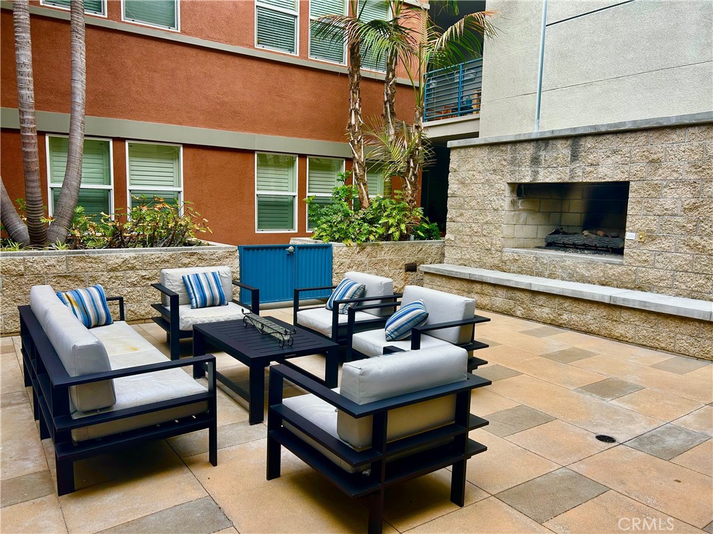 300 East 4th Street, Unit 101 Long Beach, CA 90802 - Photo 56 of 64 a outdoor living space with furniture and a fireplace