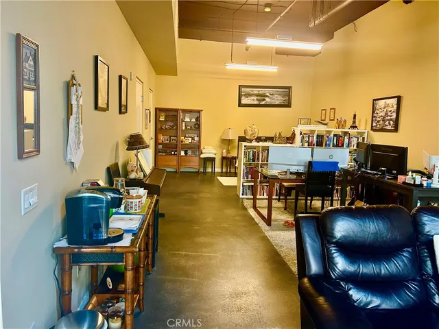 a room with furniture and a mirror