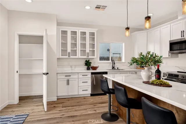 a kitchen with a table and chairs in it