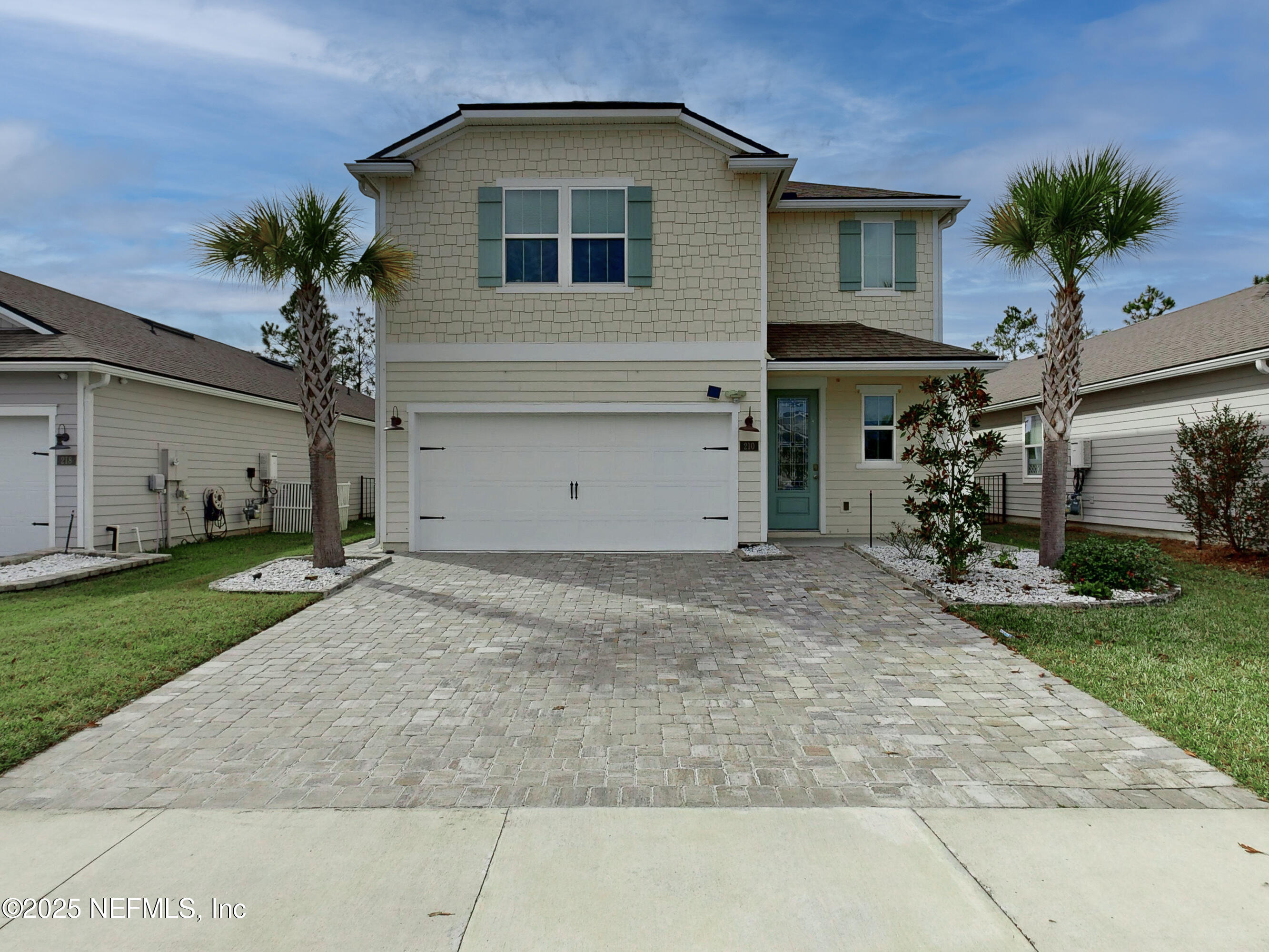 210 Thistleton Way Street St. Augustine, FL 32092 - Photo 1 of 38 a house view with a garden space