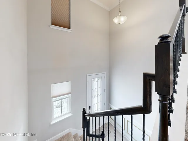 a view of a hallway with windows