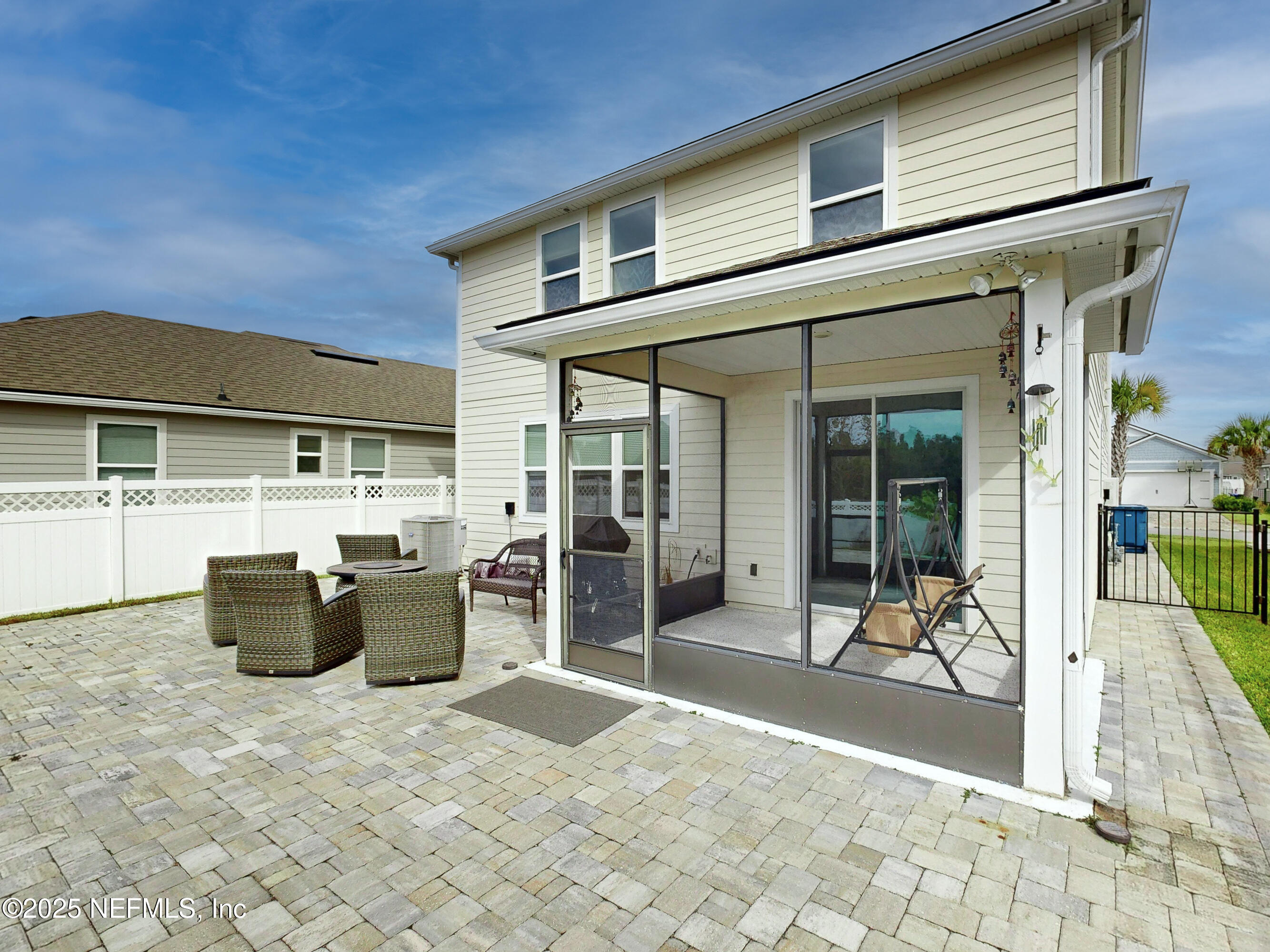 210 Thistleton Way Street St. Augustine, FL 32092 - Photo 29 of 38 a view of a patio with table and chairs