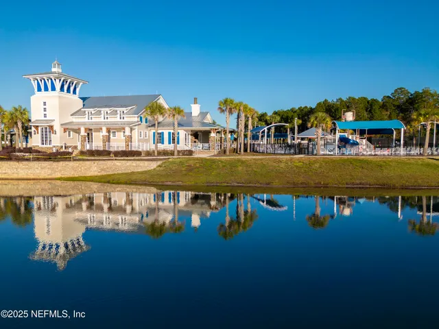 a view of a swimming pool with a yard