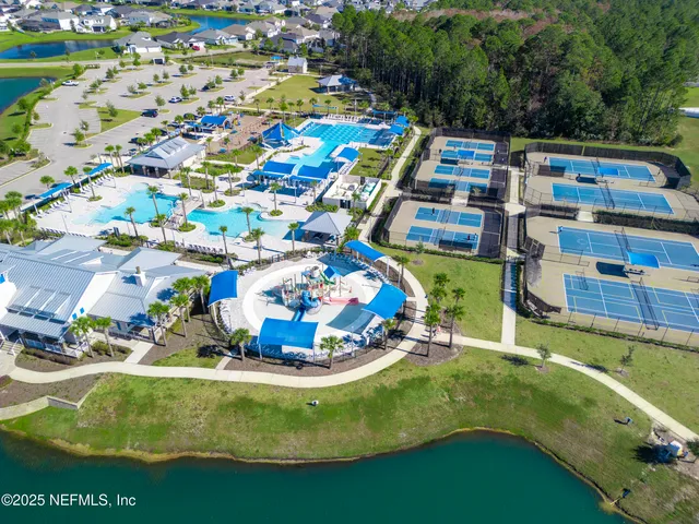 a view of swimming pool with outdoor seating and yard