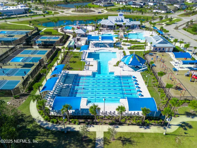 a view of swimming pool with outdoor seating