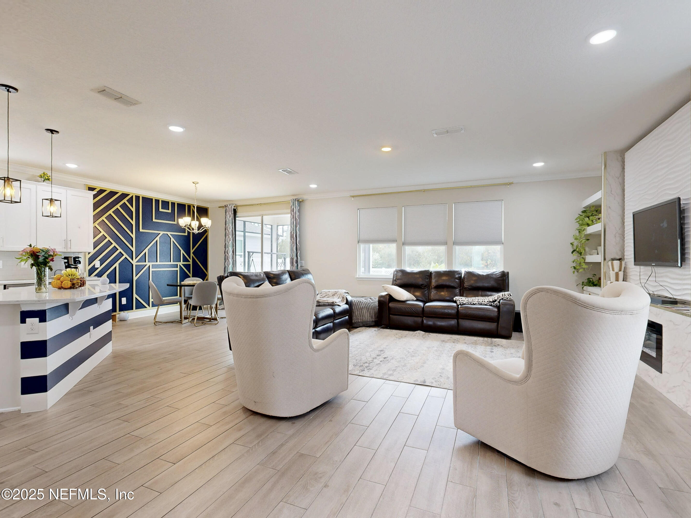 210 Thistleton Way Street St. Augustine, FL 32092 - Photo 6 of 38 a living room with furniture and a wooden floor