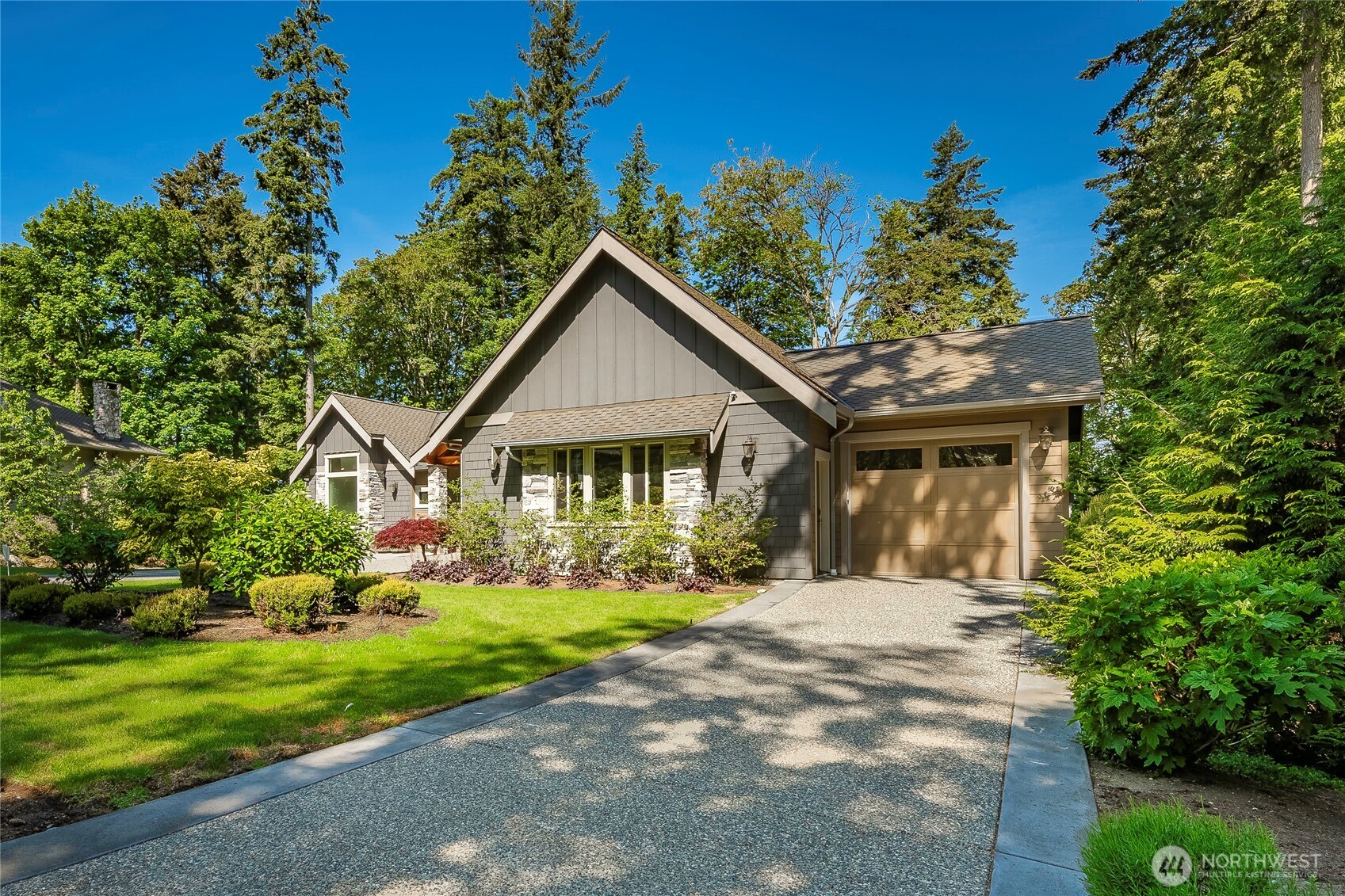 9125 Shearwater Road Blaine, WA 98230 - Photo 38 of 40 a front view of a house with a yard and potted plants