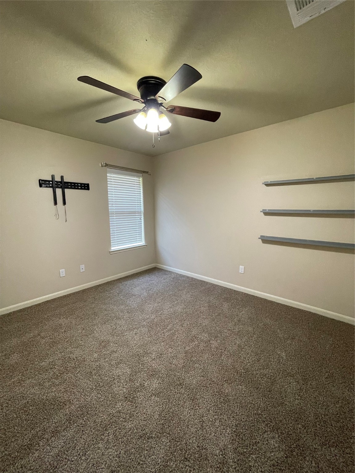 951 Oak Terrace Drive Conroe, TX 77378 - Photo 15 of 19 a view of a livingroom with a ceiling fan and window