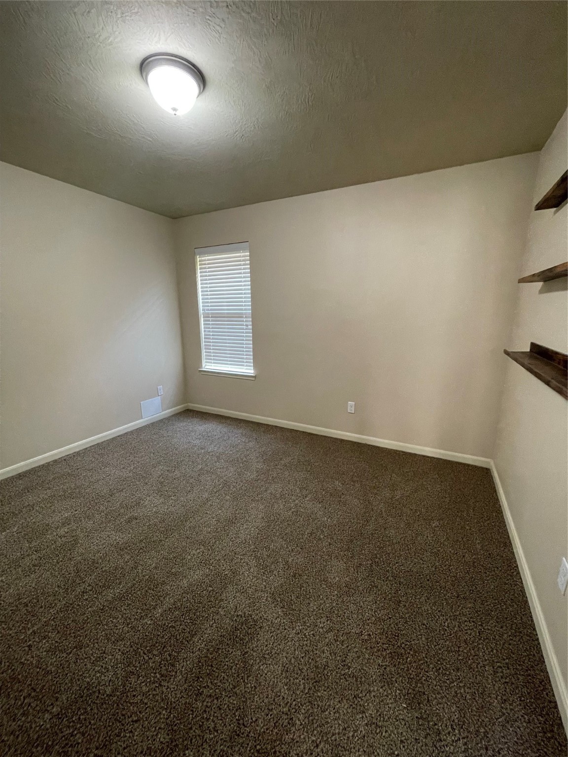 951 Oak Terrace Drive Conroe, TX 77378 - Photo 16 of 19 an empty room with a empty space and windows