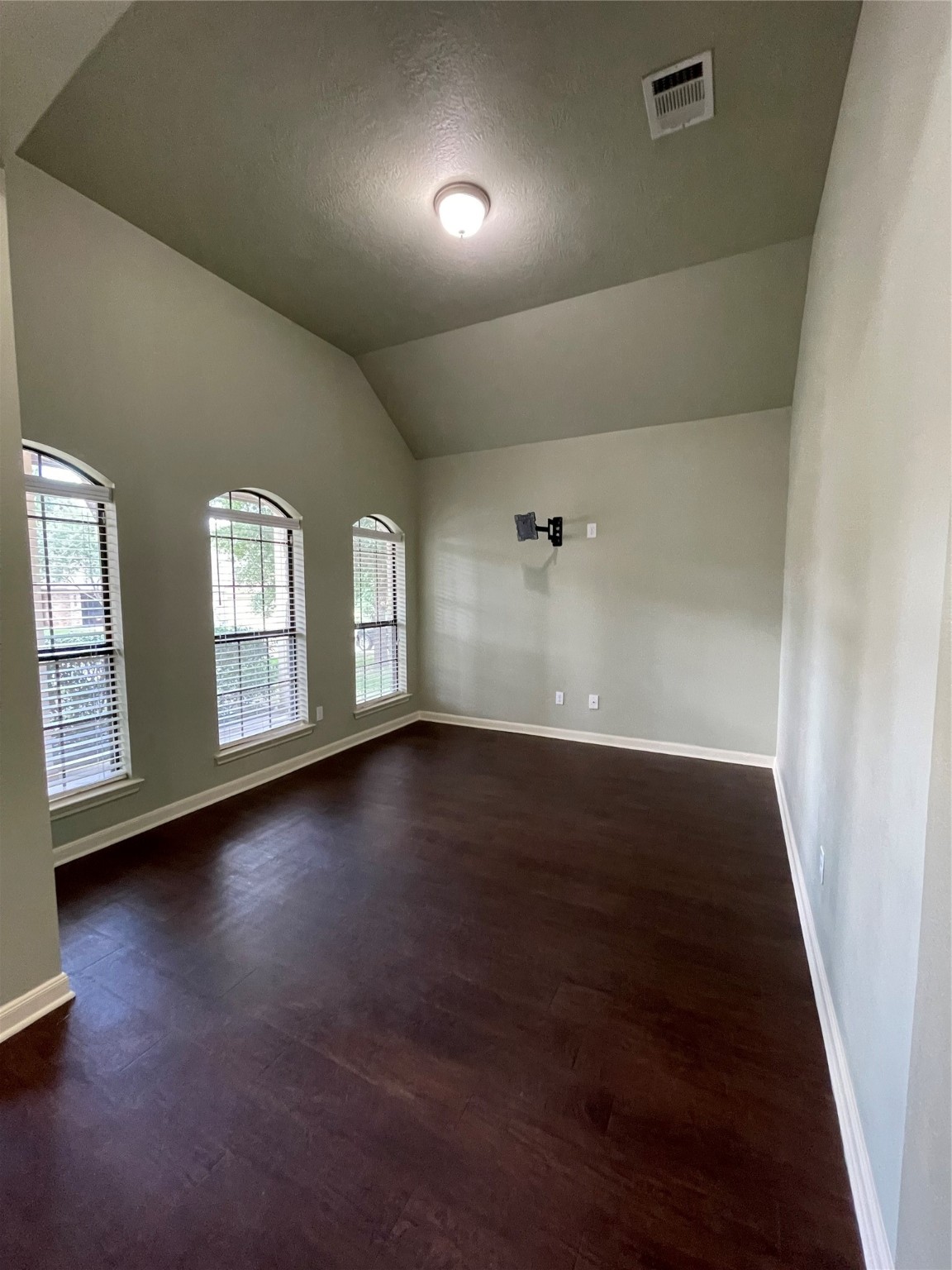951 Oak Terrace Drive Conroe, TX 77378 - Photo 3 of 19 an empty room with wooden floor and windows
