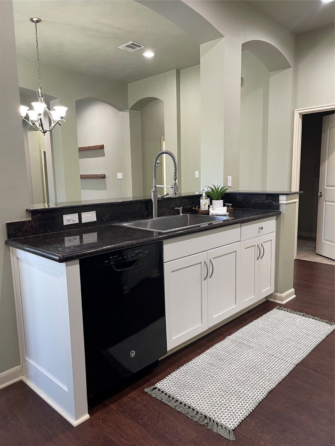 951 Oak Terrace Drive Conroe, TX 77378 - Photo 6 of 19 a kitchen with granite countertop a sink and cabinets