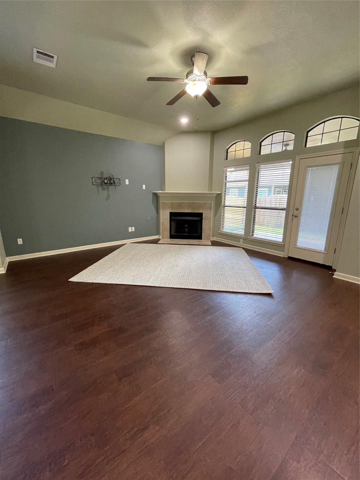 951 Oak Terrace Drive Conroe, TX 77378 - Photo 9 of 19 a view of an empty room with a fireplace and a window