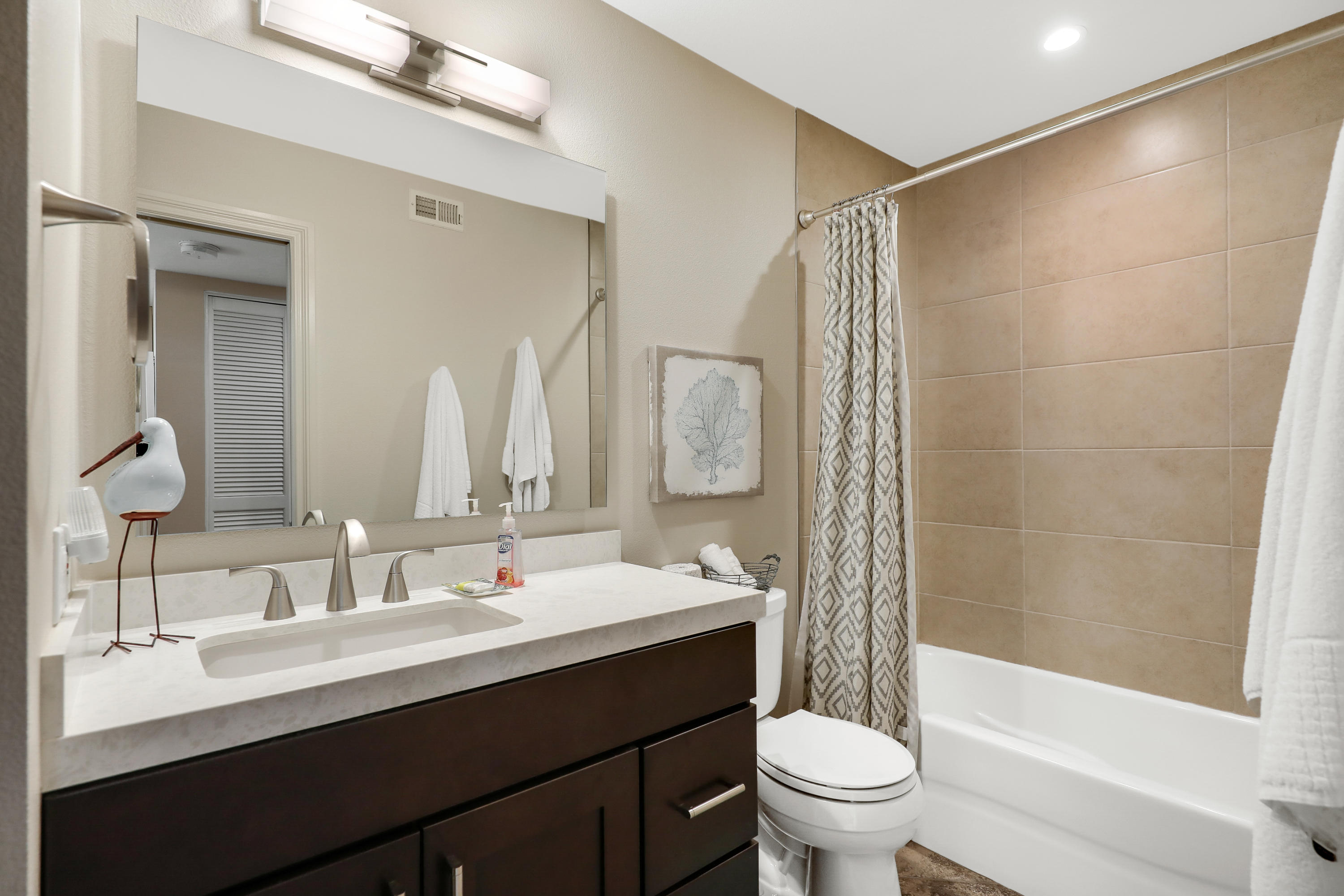 29 Leon Way Rancho Mirage, CA 92270 - Photo 12 of 17 a bathroom with a double vanity sink toilet and shower