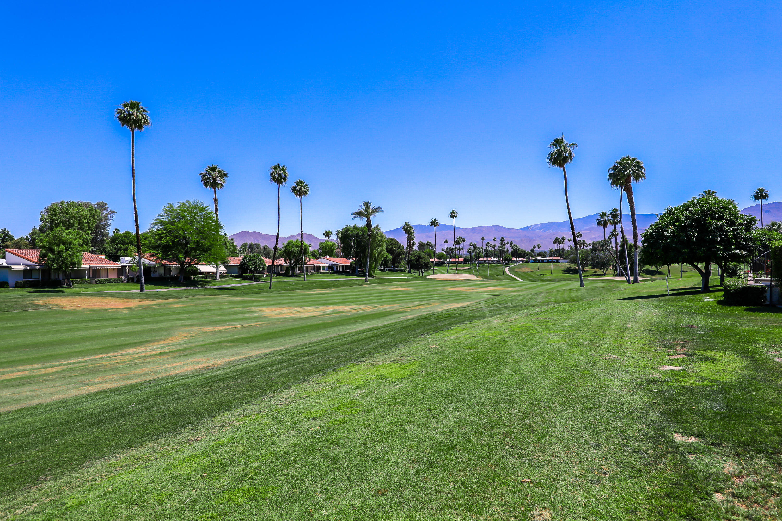 29 Leon Way Rancho Mirage, CA 92270 - Photo 17 of 17 a view of a building and trees in the background