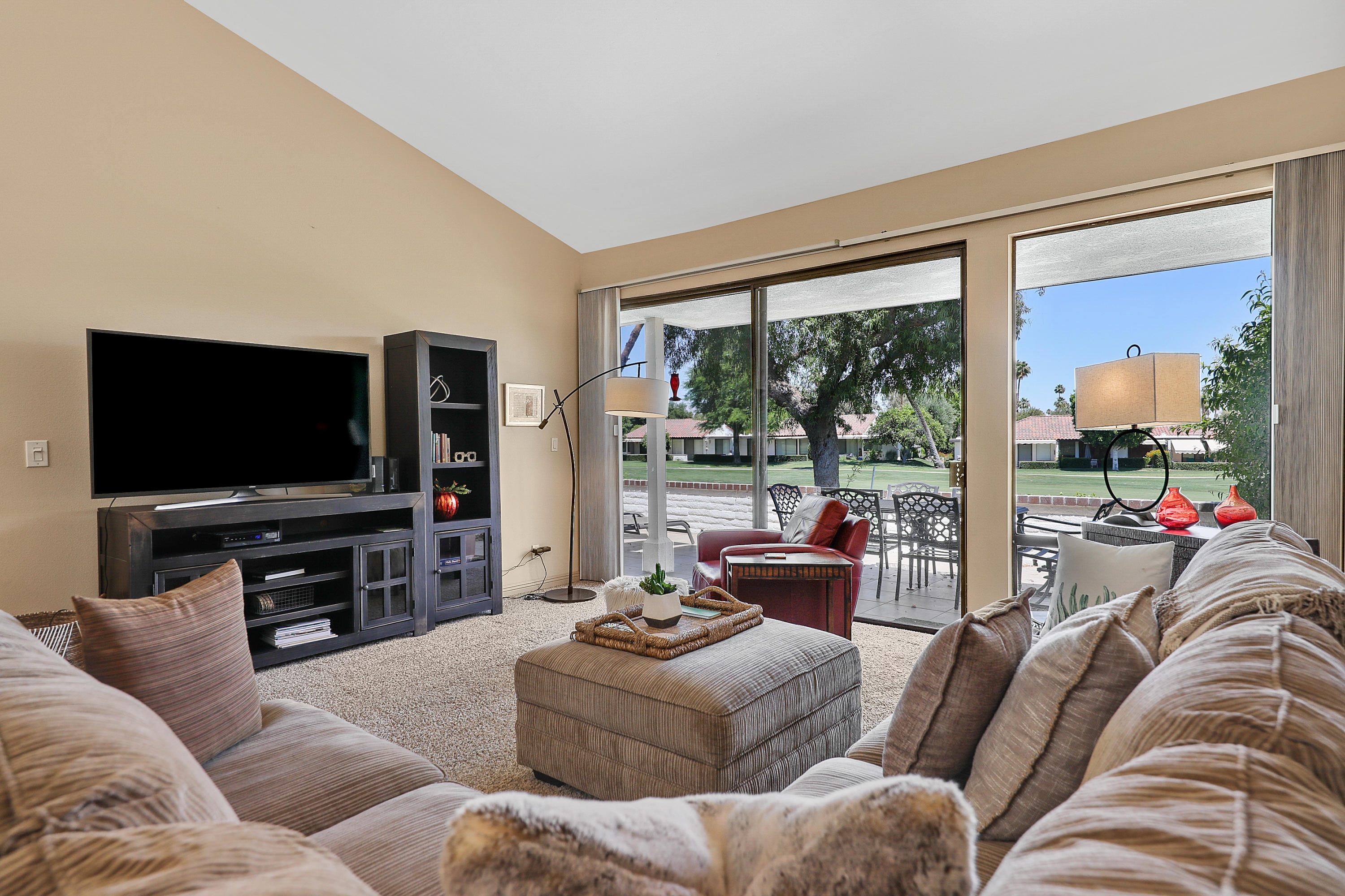 29 Leon Way Rancho Mirage, CA 92270 - Photo 3 of 17 a living room with furniture and a flat screen tv