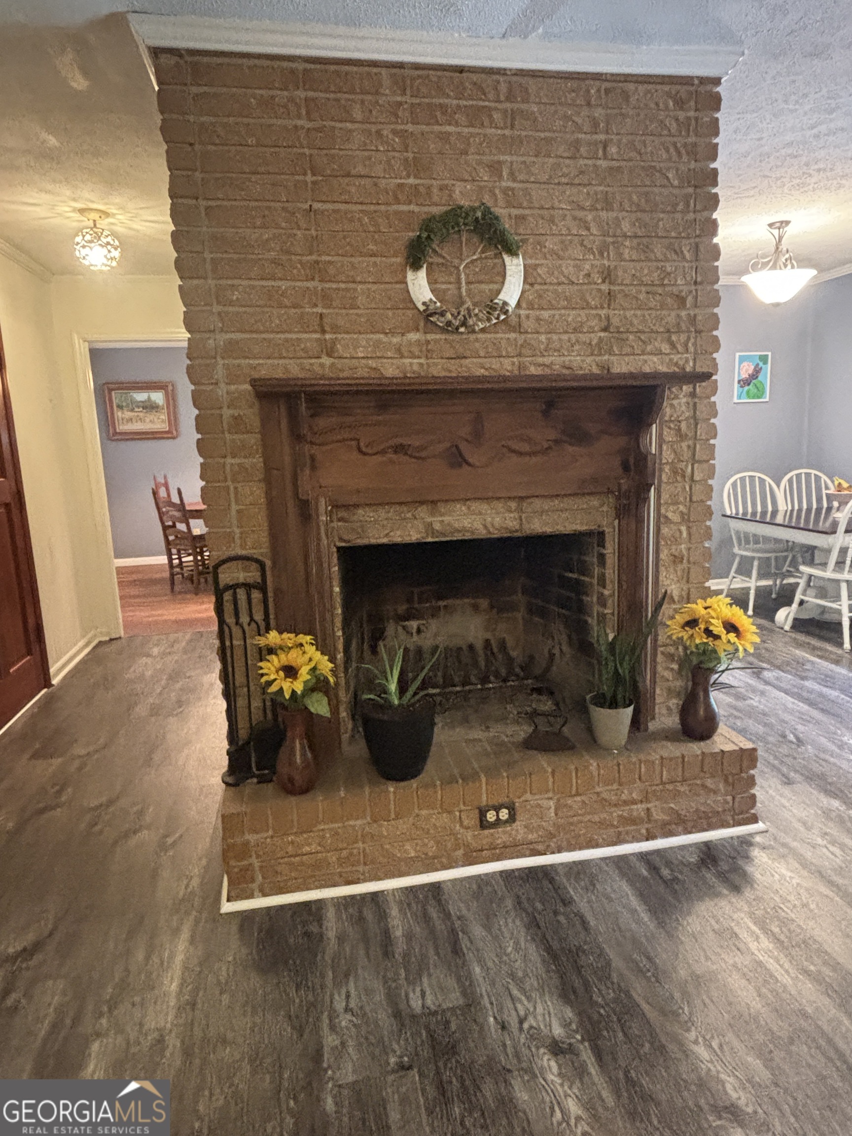 152 Crest Drive Cochran, GA 31014 - Photo 14 of 54 an empty room with furniture and a fireplace