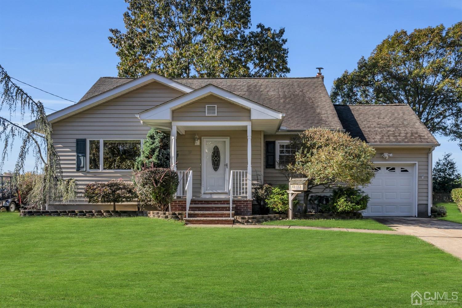 39 Latham Circle Sayreville, NJ 08859 - Photo 1 of 31 a front view of a house with a garden