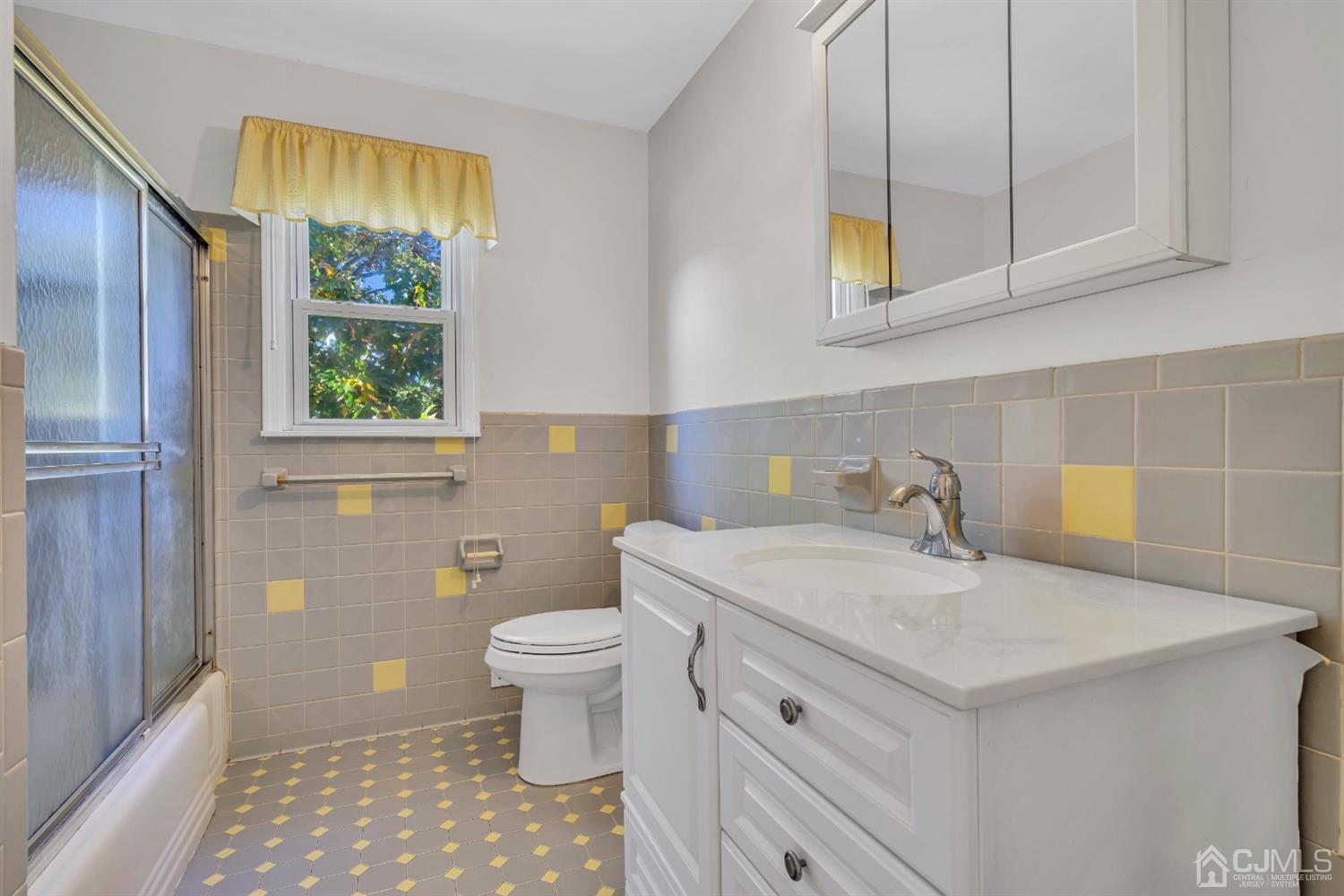 39 Latham Circle Sayreville, NJ 08859 - Photo 19 of 31 a bathroom with a sink a toilet and a window