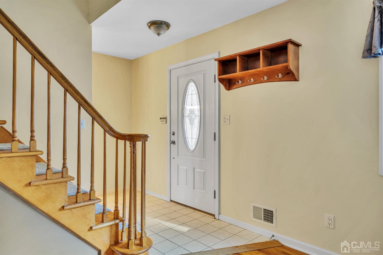 39 Latham Circle Sayreville, NJ 08859 - Photo 3 of 31 a front view of a house with wooden floor