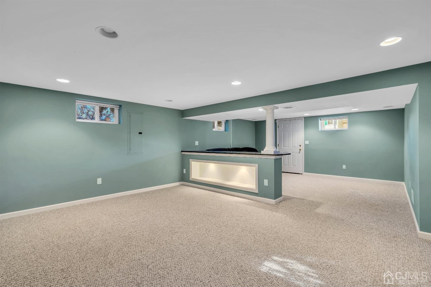 39 Latham Circle Sayreville, NJ 08859 - Photo 22 of 31 a view of an empty room with a kitchen