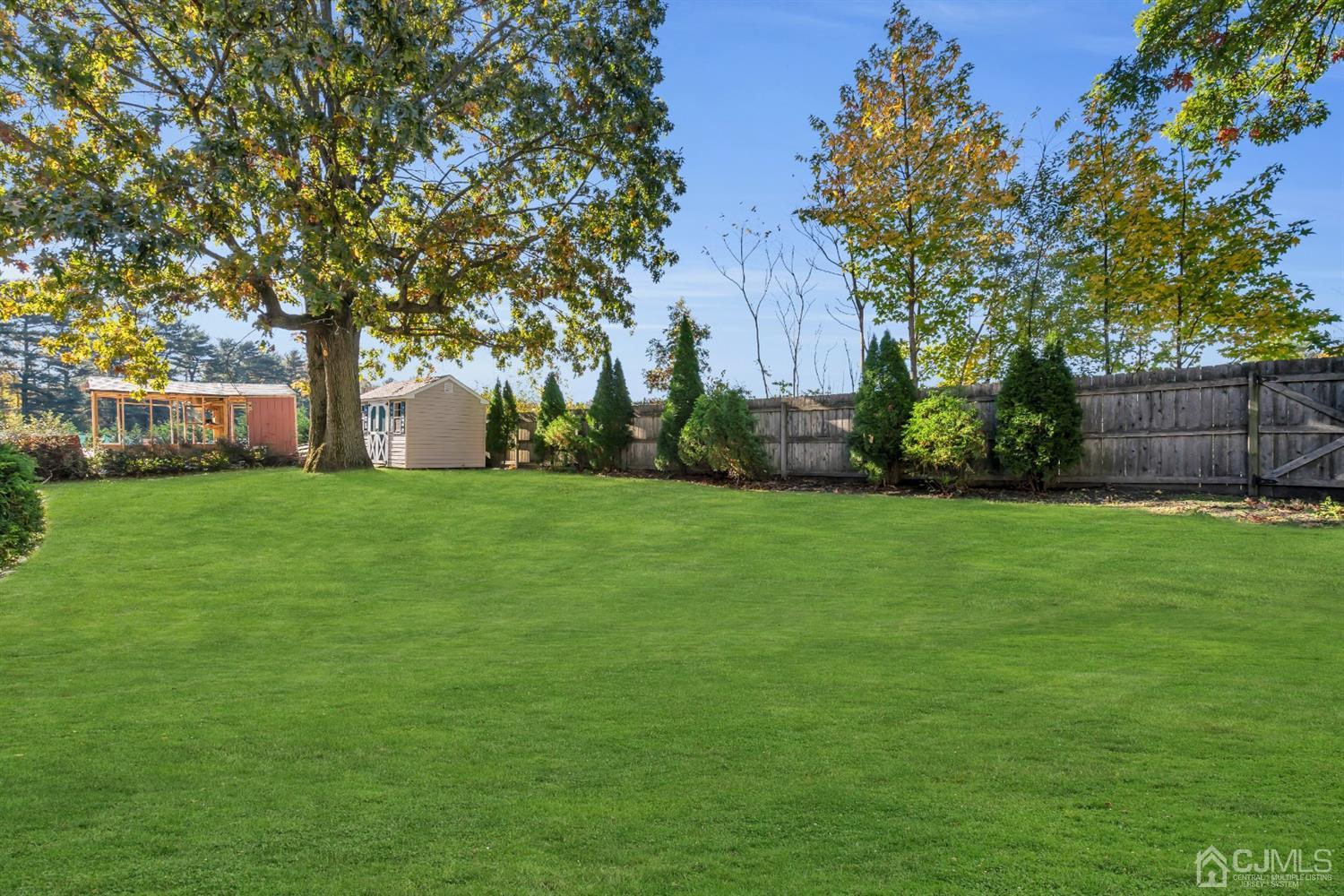 39 Latham Circle Sayreville, NJ 08859 - Photo 27 of 31 a view of a backyard with large trees
