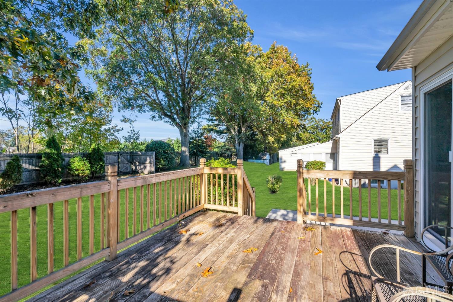 39 Latham Circle Sayreville, NJ 08859 - Photo 28 of 31 a view of a deck with a large window and wooden floor
