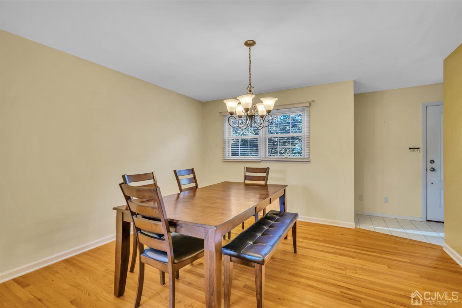 39 Latham Circle Sayreville, NJ 08859 - Photo 9 of 31 a view of a dining room with furniture wooden floor and chandelier