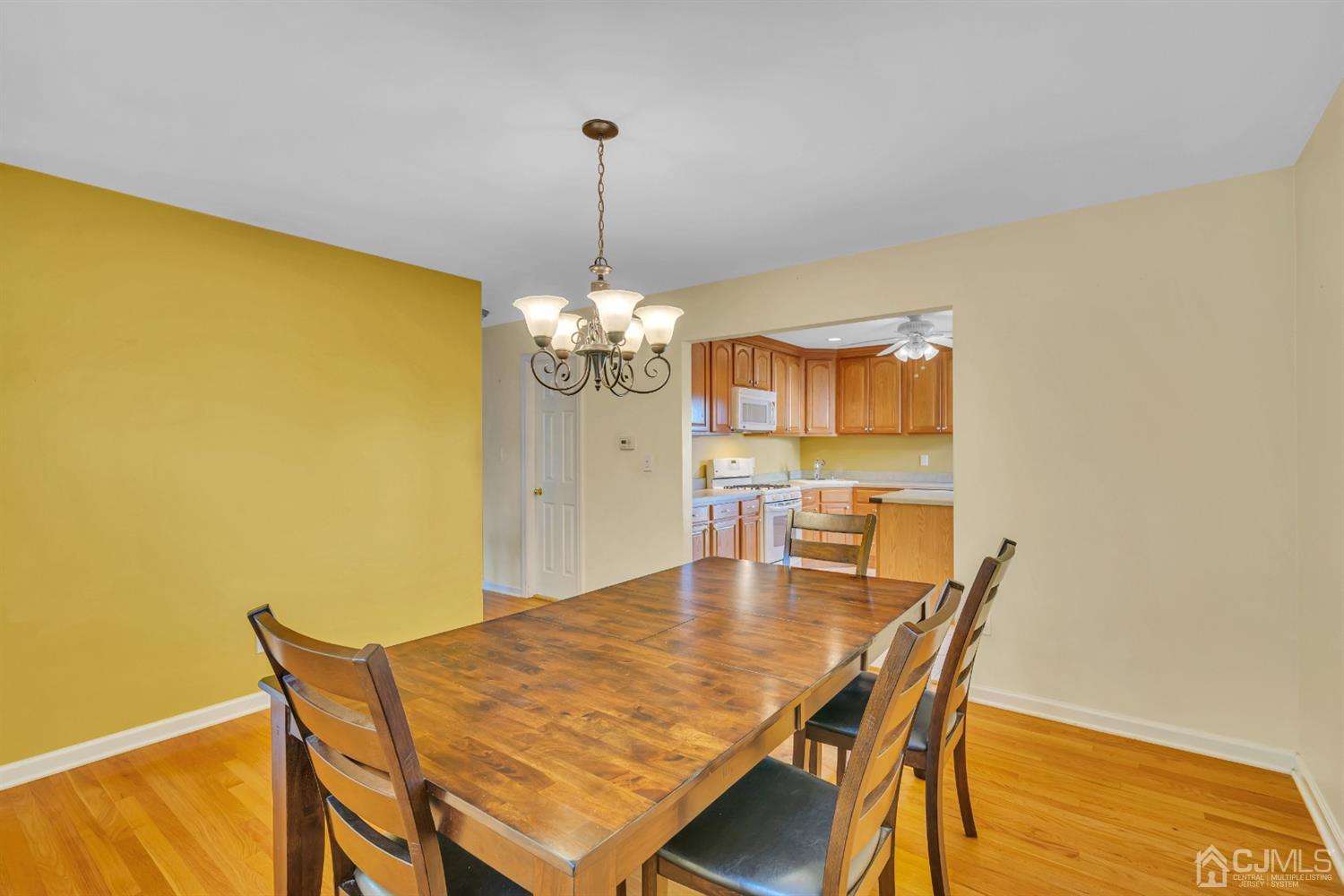 39 Latham Circle Sayreville, NJ 08859 - Photo 10 of 31 a view of a dining room with furniture and chandelier