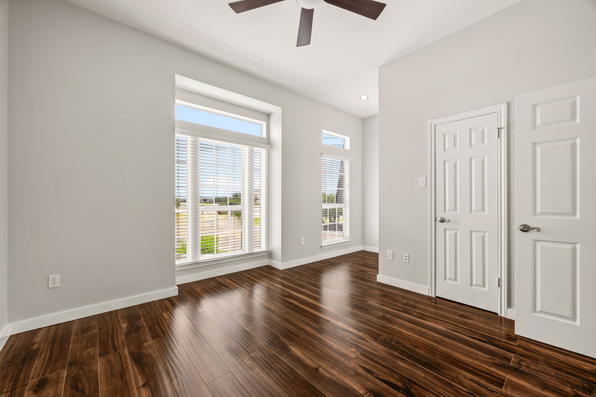 2918 Ranch Road 620 North, Unit S242 Austin, TX 78734 - Photo 28 of 35 Rich hardwood flooring creates a welcoming ambiance in this well-lit living space.