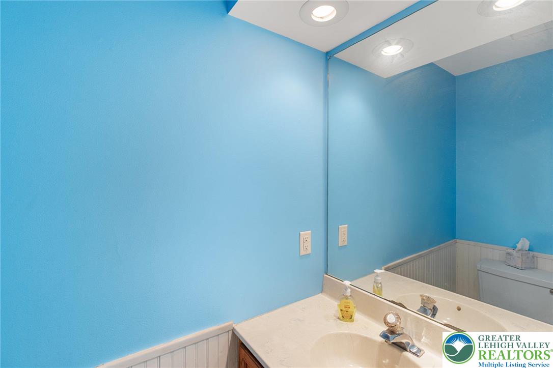 271 Maple Street Coplay, PA 18037 - Photo 12 of 25 a bathroom with a sink and a mirror