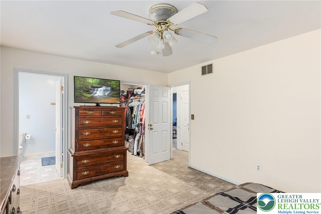 271 Maple Street Coplay, PA 18037 - Photo 14 of 25 a view of room with closet and a ceiling fan