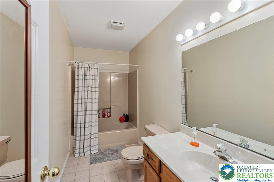 271 Maple Street Coplay, PA 18037 - Photo 18 of 25 a bathroom with a sink toilet and shower