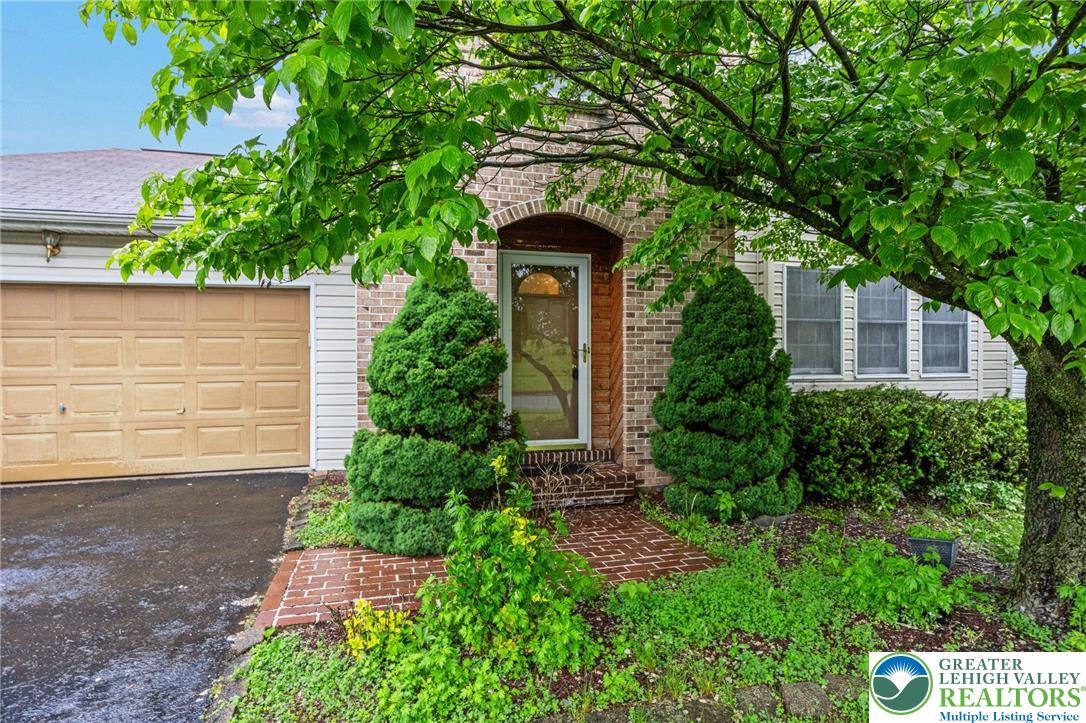 271 Maple Street Coplay, PA 18037 - Photo 3 of 25 a front view of a house with garden