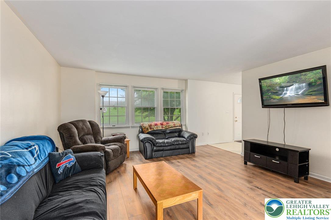 271 Maple Street Coplay, PA 18037 - Photo 5 of 25 a living room with furniture and a flat screen tv