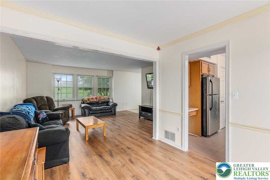 271 Maple Street Coplay, PA 18037 - Photo 8 of 25 a living room with furniture and wooden floor