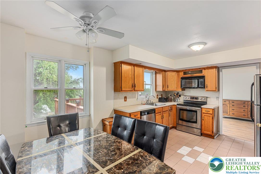 271 Maple Street Coplay, PA 18037 - Photo 9 of 25 a kitchen with stainless steel appliances granite countertop a sink stove and refrigerator