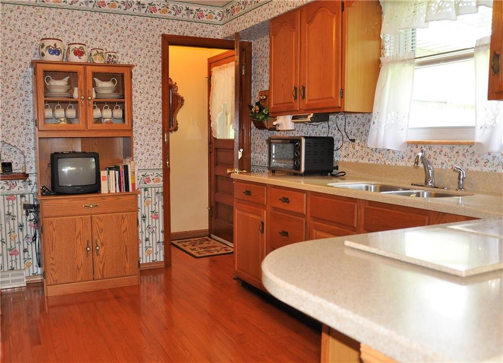 132 Siebert Road Pittsburgh, PA 15237 - Photo 14 of 23 Kitchen, oak cabinets, Bruce's hardwood floor and corian countertops. (12x9)