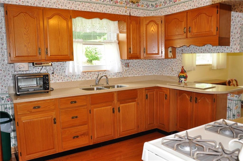 132 Siebert Road Pittsburgh, PA 15237 - Photo 15 of 23 Nice oak cabinets and corian countertops. (12x9)