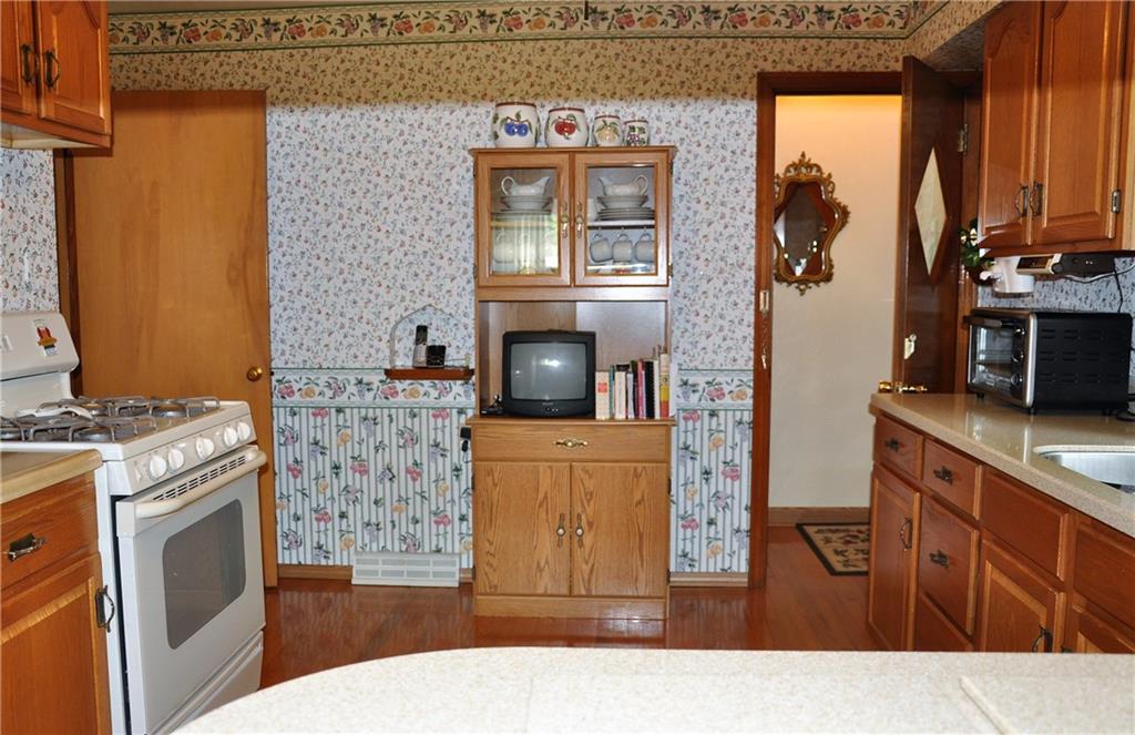 132 Siebert Road Pittsburgh, PA 15237 - Photo 16 of 23 Kitchen, door leads to either the basement or the 3 season room.