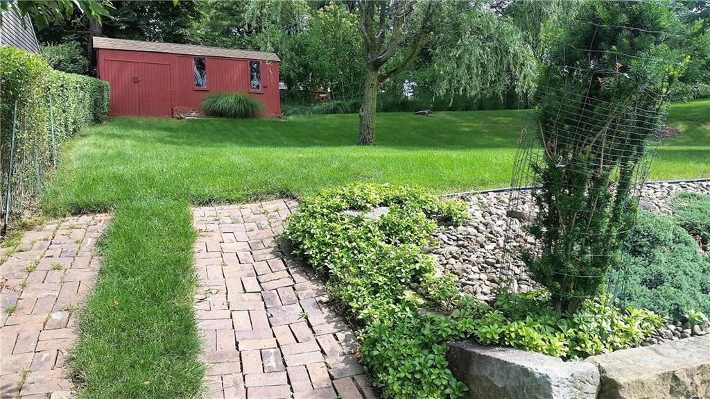 132 Siebert Road Pittsburgh, PA 15237 - Photo 7 of 23 Pathway to red storage shed and upper backyard.