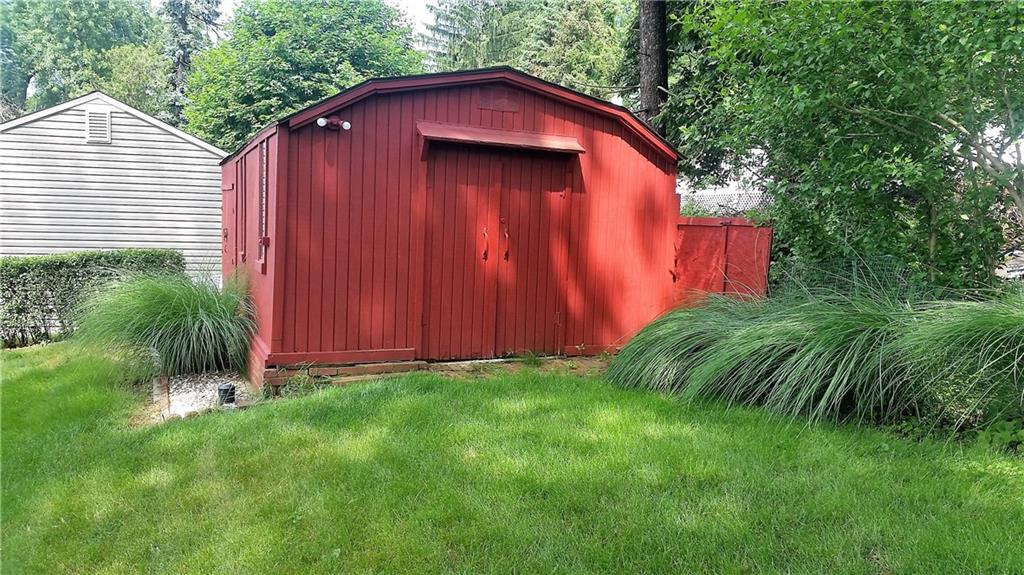 132 Siebert Road Pittsburgh, PA 15237 - Photo 8 of 23 Red storage shed, has two rooms, one for mower and a work room, also has electric.