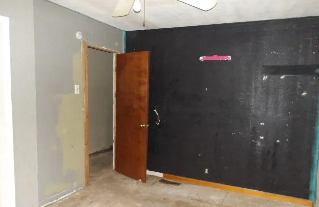 a bathroom with a shower and a glass door
